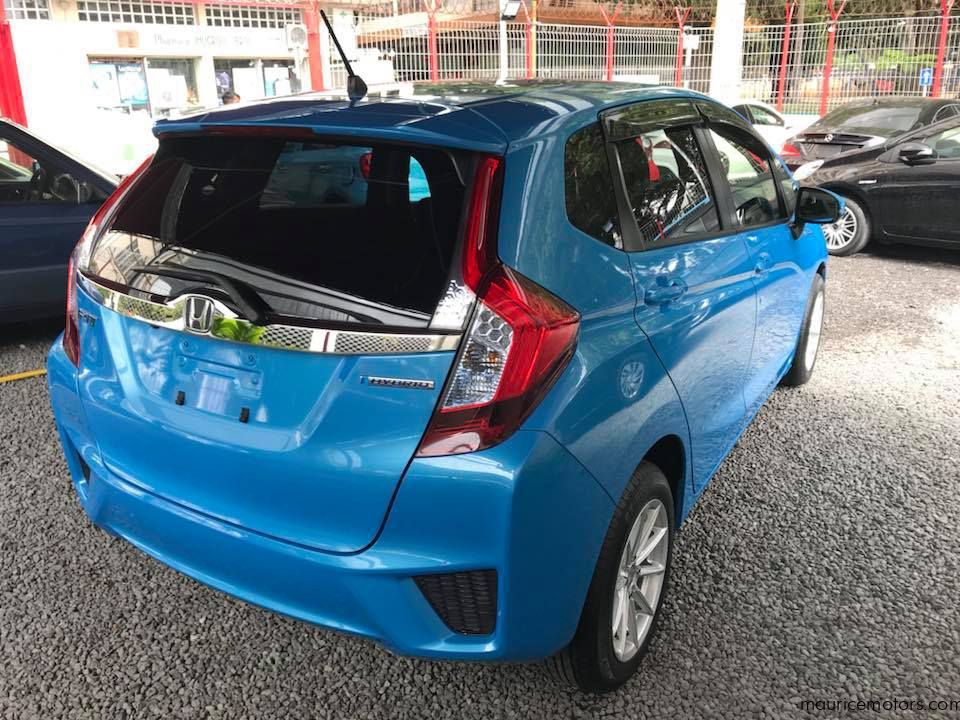 Хонда фит гибрид. Honda Fit 2014 гибрид. Хонда фит 2014. Honda Fit Hybrid. Honda Fit Hybrid 2014 Blue.